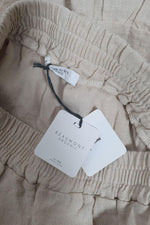 Load image into Gallery viewer, BEAUMONT ORGANIC Rose Bone Peplum Hem Mini Skirt (S)-The Freperie