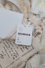 Load image into Gallery viewer, FREE PEOPLE Ivory Floral Embroidered Low Back Strappy Micro Mini Dress (0)-The Freperie
